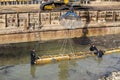 Diver workers working on concrete footings in water