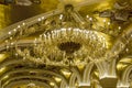 Golden chandelier with frescoes and arches