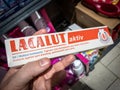 BELGRADE, SERBIA - FEBRUARY 15, 2024: Lacalut logo on packages of toothpaste for sale. Lacalut is a German brand of oral hygiene