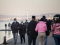 Selective blur on Old senior man and woman, couple, wearing a facemask, waking in street of Zemun, Belgrade during  coronavirus Royalty Free Stock Photo