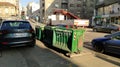 Belgrade, Serbia. January 24, 2020. Garbage containers in the city center. Roadway with cars. Asphalt road