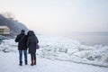 People, a couple of lovers, walking next to the frozen Danube, due to an exceptionnaly cold weather over the Balkans