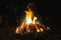 BELGRADE, SERBIA - JANUARY 6, 2023: Selective blur on Serbian People burning badnjak branches in Belgrade during Orthodox