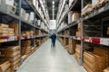 Belgrade, Serbia - January 02, 2023: Warehouse aisle in an IKEA store. Man walking i IKEA furniture warehouse area