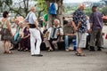 Serbian old people having fun and laughing playing accordeon in the main park of Belgrade, Kalemegdan fortress, in summer