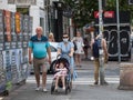 Selective blur on a family, grandfather, grandmother, senior, and their grandchild, in a stroller,