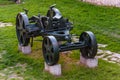Artillery guns and weapons stand on stone foundations as part of outdoor exposition of various artillery weapons on territory of Royalty Free Stock Photo