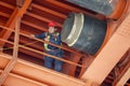 Metal worker posing during installation of district heating pipeline