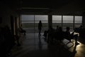 Silhouetts of passengers waiting at airport Royalty Free Stock Photo