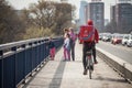 Donesi Dostava logo on a bicycle on a delivery guy in Belgrade.