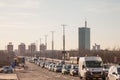 Traffic Jam of cars and other vehicles on Brankov Most bridge at peak hour, under heavy pollution, during sunset.