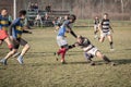 Rugby tackle between two male players during a training of a local Serbian Rugby team with white caucasian men confronting