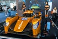 Beautiful hostess girls standing next to the racing sports car at the Belgrade Car and Motor Show in Belgrade, Serbia Royalty Free Stock Photo