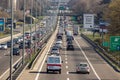 Highway crowded with all sort of vehicles.