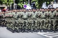 Rows of military troop marching on streets during sunny summer day Royalty Free Stock Photo