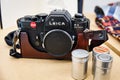 Old Leica R3 35mm SLR camera with packs of film Royalty Free Stock Photo