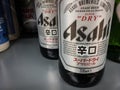 Logo of Asahi breweries on bottles of beer for sale.