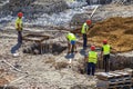 Construction workers setting steel