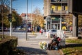 Selective blur on a senior worker, old man, selling flowers as a florist in the city center of Belgrade