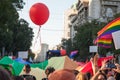 Crowd of protestors holding rainbow gay flags and balloons during the Belgrade Gay Pride.