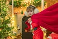 Believe in christmas miracle. Wish to meet santa claus. Boy child play near christmas tree. Santa boy celebrate Royalty Free Stock Photo