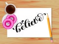 Believe lettering. Wooden Table with coffee. Vector illustration