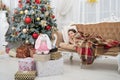 Believe in miracles. Magical moment. Christmas night. Happy new year. Family holiday. Christmas tree and presents Royalty Free Stock Photo