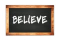 BELIEVE text written on wooden frame school blackboard Royalty Free Stock Photo