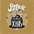 Believe in X mas- Christmas typographic poster, greeting card, print. Winter holiday saying.Hand lettering inside Christmas bell. Royalty Free Stock Photo