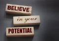 Believe in Your Potential word written on wooden blocks. Motivation for achievements in business or career concept Royalty Free Stock Photo