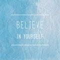 Believe in yourself quote on blue crumpled paper