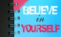 Believe in Yourself words on sky blue page of copybook. Business concept Royalty Free Stock Photo