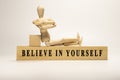 Believe in yourself written on wooden surface Royalty Free Stock Photo