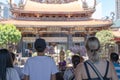 Believers piously worship in the Bangka Longshan Temple