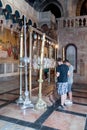 Believers pray at the entrance to the Church of the Holy Sepulchre in Jerusalem, Israel.