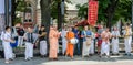 Believers of the Society for Krishna Consciousness in the center of Lviv in Ukraine, near the Opera House plays drums, harmonica