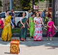 Believers of the Society for Krishna Consciousness in the center of Lviv in Ukraine, near the Opera House plays drums, harmonica