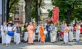 Believers of the Society for Krishna Consciousness in the center of Lviv in Ukraine, near the Opera House plays drums, harmonica