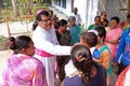 Believers welcome the bishop in front of Our Lady of Lourdes Church in Kumrokhali, India