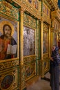 A believing Christian woman looking at icons in the monastery of St. John the Baptist in Christian quarters in the old city of