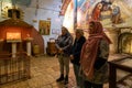 Believing women sing prayers in the Cave of the Shepherds in the Greek Orthodox Shepherds Field in Beit Sahour, in the Palestinian