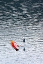 BELIS-FANTANELE, ROMANIA, AUGUST 12, 2023: Man in his overturned kayak on Belis-Fantanele dam lake.