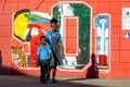 Two kids walking on the street of Belize city