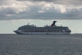 Belize coast - January 1, 2020: Aerial shot of Carnival Conquest anchored off the coast of Belize and a small tender boat by her. Royalty Free Stock Photo