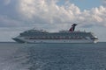 Belize coast - January 1, 2020: Aerial shot of Carnival Freedom anchored off the coast of Belize and two small tender boats by her Royalty Free Stock Photo