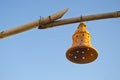 Bell form clay lamp on bamboo Royalty Free Stock Photo