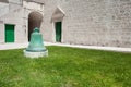 Bell, grass, doors and church Royalty Free Stock Photo