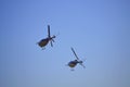 Bell-206 helicopters parallel fly