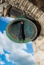 Bell in old colonial church. Ancient village Altos de Chavon - Colonial town reconstructed in Dominican Republic