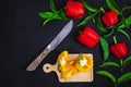 Bell pepper cut in half on a wooden cutting board on a black background. Royalty Free Stock Photo